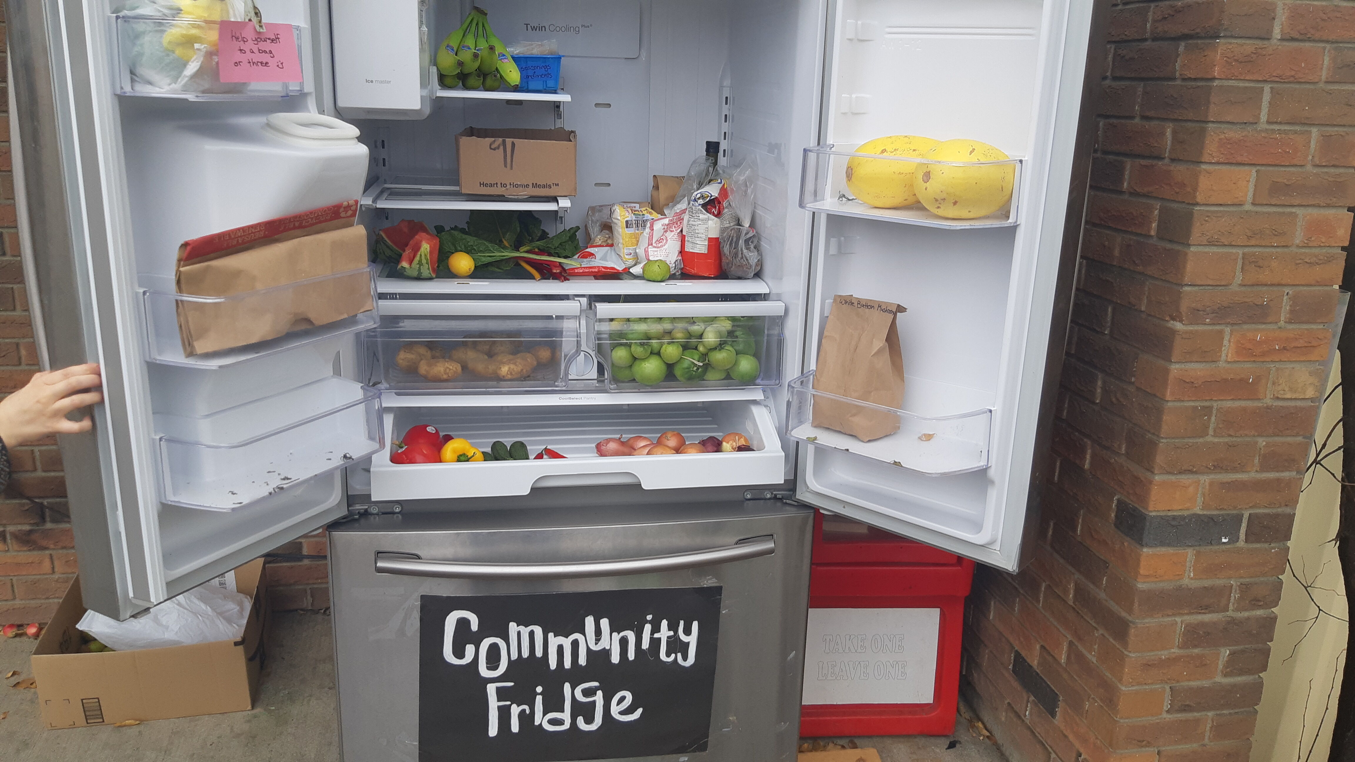 An image of a community fridge full with fresh produce.
