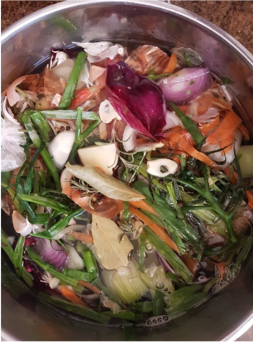 Image of pot in which vegetable scraps are cooking.